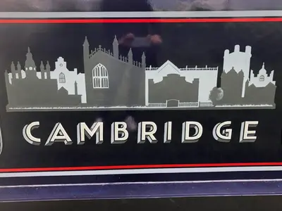 a sign that reads cambridge with a city on it at Cambridge Narrowboats - Beautiful New Moon Narrowboat in Cambridge
