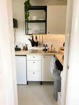 a kitchen with a sink and a counter top at Cozy studio near train station in Cambridge