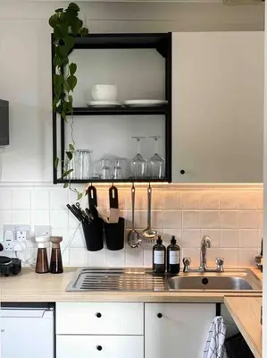 a kitchen with a sink and a counter top at Cozy studio near train station in Cambridge