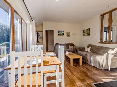 a living room with a couch and a table at 2 Bed in Norwich oc-64075 in East Harling