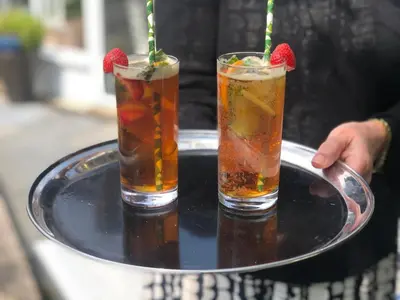 two drinks on a tray with strawberries on it at Sheene Mill in Melbourn