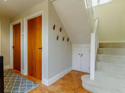 a staircase in a home with a stair case at 3 Bed in Saxmundham oc-89691 in Aldringham