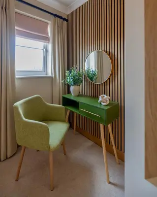 a room with a green chair and a mirror at Luxury Stay, City Walk, Pool Table & Air Hockey, Garden, Parking, Business & Families - Oakview in Colchester
