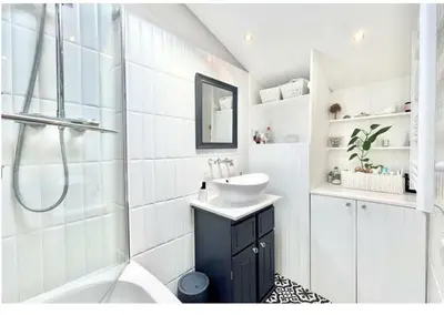 a bathroom with a sink and a tub and a shower at Chelmsford Cottage Free Parking Fab Garden in Great Waltham