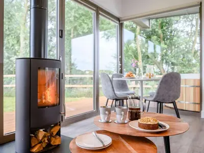 a fireplace in a living room with a table with food at 2 Bed in Colchester oc-82398 in East Bergholt