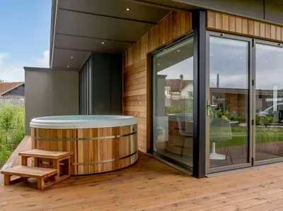 a house with a circular pool and a bench on a deck at 2 Bed in Colchester oc-82398 in East Bergholt