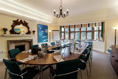 a large conference room with a long table and chairs at Westminster College in Cambridge
