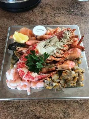a plate of shrimp and seafood on a table at Lazeeedays on Mersea Island in Colchester