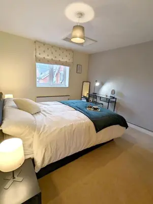 a bedroom with a large bed and a window at 3-Bed, Sleeps 6, 1 Bath, Parking, WiFi in Bramford