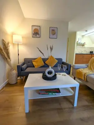a living room with a couch and a white coffee table at 3-Bed, Sleeps 6, 1 Bath, Parking, WiFi in Bramford