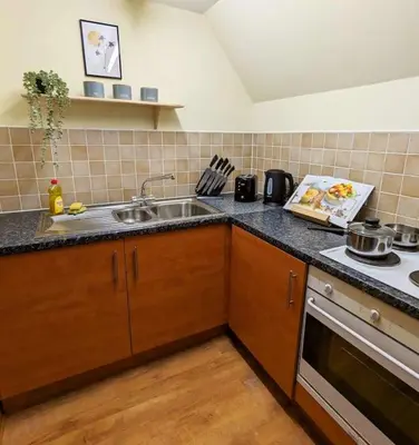 a kitchen with a sink and a stove at 3-Bed, Sleeps 6, 1 Bath, Parking, WiFi in Bramford