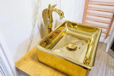 a gold tray with a watch in it on a table at The Famous Harry Potter House, Hot Tub, Cinema Room, Sky TV in Saffron Walden