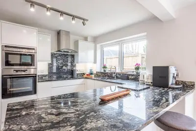 a kitchen with a large marble counter top at 111 Front Street, Orford in Woodbridge