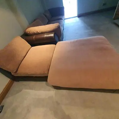 a brown couch sitting in a living room at Beautiful and Cozy 2 Bedroom Apartment Billericay in Billericay