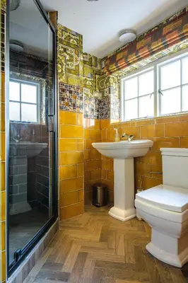 a bathroom with a sink and a shower and a toilet at Luxury 3 Bed Manor House Hot Tub Cinema Room SkyTV in Saffron Walden
