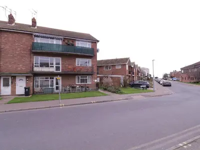 an apartment building on the corner of a street at The Upper Circle in Clacton-on-Sea
