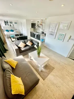 a living room with a couch and a table at City Centre Cozy Studio flat Second Floor in Cambridge