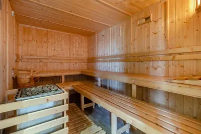 an empty wooden sauna with wooden benches at 2 Bed in Heveningham oc-w29035 in Heveningham