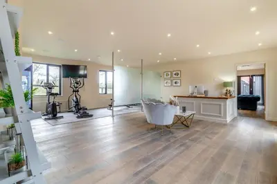 a large living room with wood floors and a room with a camera at 2 Bed in Heveningham oc-w29034 in Heveningham