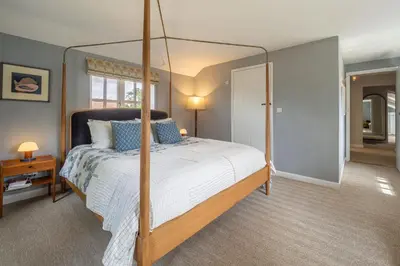 a bedroom with a canopy bed in a room at Foxhole Cottage 10 in Stowmarket