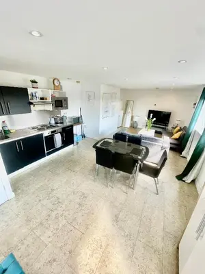 a living room with a couch and a table at Studio - Sleeps 2 - Parking - Wifi in Cambridge
