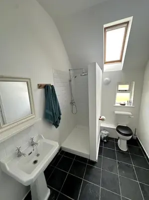 a bathroom with a sink and a shower and a toilet at Mersea best kept secret in Colchester