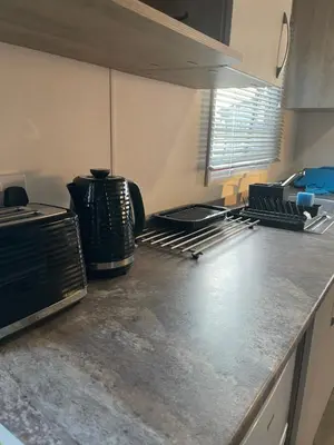 a kitchen with a counter top with a appliance on it at Caravan at Seawick Holiday Park Close to Beach in Saint Osyth
