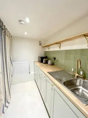 a kitchen with a sink and a counter top at Willow Barn, Long Melford in Long Melford