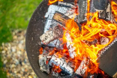 a close up of a fire in a grill at Kestrel - Sweffling Hall in Rendham