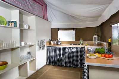 a kitchen with a sink and a counter with fruits and vegetables at Kestrel - Sweffling Hall in Rendham