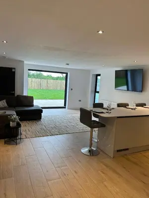 a living room with a couch and a table at Cosy nook in Hardwick