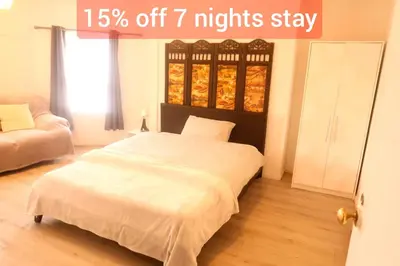 a bed in a bedroom with a sign that reads off nights stay at Cambridge city centre accommodations in Cambridge