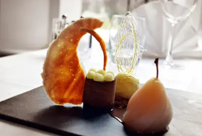 a plate of food on a table with food at Heritage Grange at Thurston, Hotel in Bury Saint Edmunds