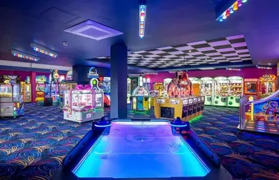 a gaming room with arcade games and a pool table at 8 berth caravan Martello Beach Clacton in Jaywick Sands