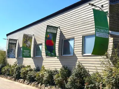a building with banners on the side of it at Colchester City Luxury With Free Parking and 5 G WIFI in Colchester