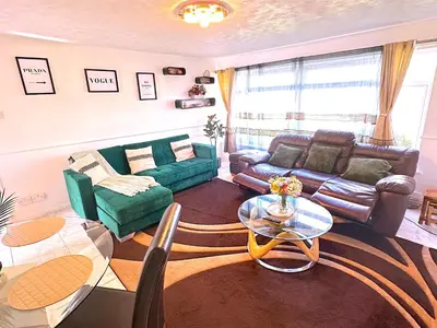 a living room with a couch and a table at Colchester City Luxury With Free Parking and 5 G WIFI in Colchester
