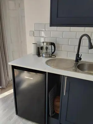 a kitchen with a sink and a counter top at Rocklands Retreat in Rockland Saint Peter