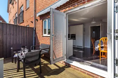 an open patio with a table and chairs on a balcony at 3 Bed in Felixstowe oc-p29748 in Felixstowe