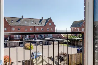 a balcony with a view of a parking lot at 3 Bed in Felixstowe oc-p29748 in Felixstowe