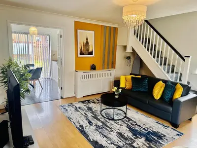 a living room with a couch and a rug at Kinlett close in Mile End