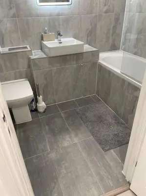 a bathroom with a sink and a shower and a toilet at 1 Bedroom Apartment By Brookland Stays Serviced Accommodation Short Lets Essex With Free WIFI in Brentwood