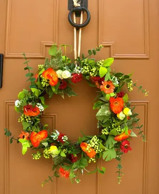 a flower wreath hanging on a door at Luxury 2 Bed Manor House Hot Tub Cinema Room SkyTV in Saffron Walden