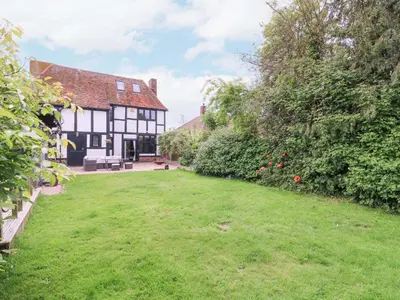 an exterior view of a house with a yard at Home by the Sea in Clacton-on-Sea