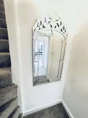 a mirror on a wall next to a staircase at 2 Bed Flat - Sleeps 5 - Parking - Wifi in Cambridge