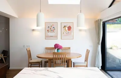a dining room with a table and chairs at 3 Bedroom House with Courtyard Garden and Parking in Chesterton
