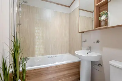 a bathroom with a bath tub and a sink at 2 Bed in Welney oc-s29764 in Welney