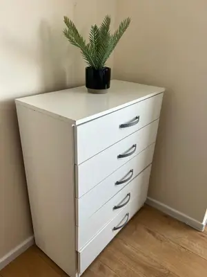 a white dresser with a plant on top of it at Luxurious 3 Bedroom Contractor House Stevenage by Randz Property Group - Short Lets l Sleeps 6 l Free Parking & Wifi in Stevenage