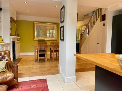 a kitchen and dining room with a table and chairs at Beautiful Victorian House in Central Chelmsford in Chelmsford