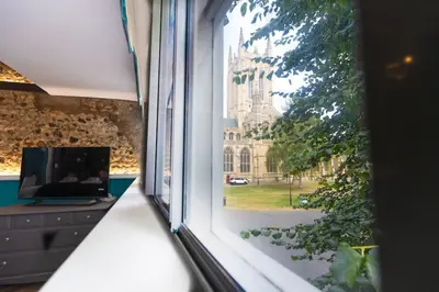 a window with a view of a building at Central Medieval Grid Unique home with Gated parking in Bury Saint Edmunds
