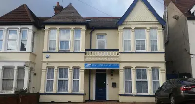 a house with a blue door in front of it at Southend Guest House - Close to Beach, Train Station & Southend Airport in Southend-on-Sea